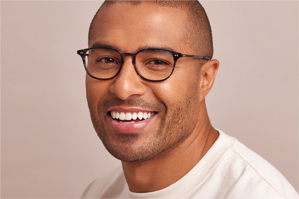 Charlie eyeglasses frame worn by model.